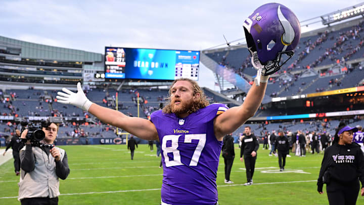 Nov 24, 2024; Chicago, Illinois, USA; Minnesota Vikings tight end T.J. Hockenson (87) celebrates after the game against the Chicago Bears at Soldier Field.