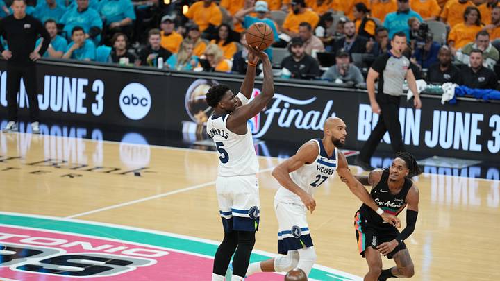 May 4, 2026; San Antonio, Texas, USA; Minnesota Timberwolves guard Anthony Edwards (5) shoots in front of San Antonio Spurs guard Devin Vassell (24) in the second half during game one of the second round of the 2026 NBA Playoffs at Frost Bank Center. Mandatory Credit: Daniel Dunn-Imagn Images