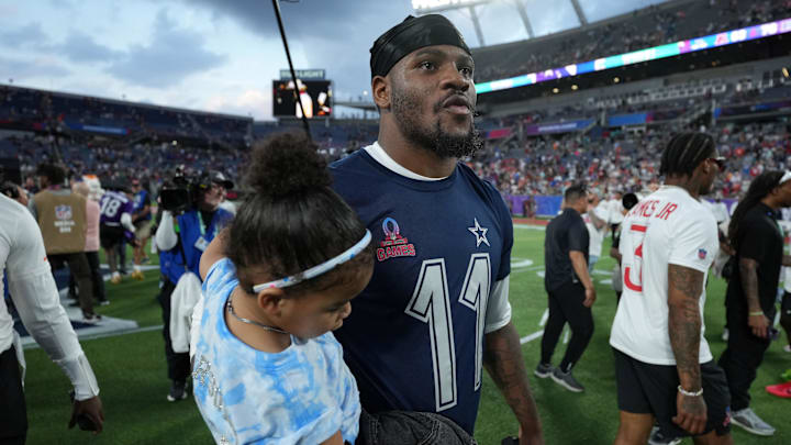 NFC defensive end Micah Parson of the Dallas Cowboys holds his daughter Shatara Parsons after the 2025 Pro Bowl Games.