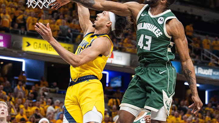 May 2, 2024; Indianapolis, Indiana, USA; Indiana Pacers guard Kendall Brown (10) shoots the ball while Milwaukee Bucks forward Thanasis Antetokounmpo (43) defends during game six of the first round for the 2024 NBA playoffs at Gainbridge Fieldhouse. Mandatory Credit: Trevor Ruszkowski-Imagn Images