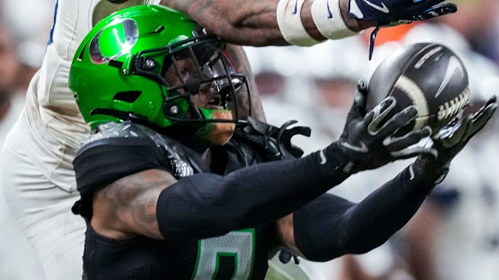 Oregon Ducks defensive back Nikko Reed (9) intercepts a pass Saturday, Dec. 7, 2024, during the Big Ten Championship game between the Oregon Ducks and the Penn State Nittany Lions at Lucas Oil Stadium in Indianapolis. The Ducks defeated the Nittany Lions, 45-37.