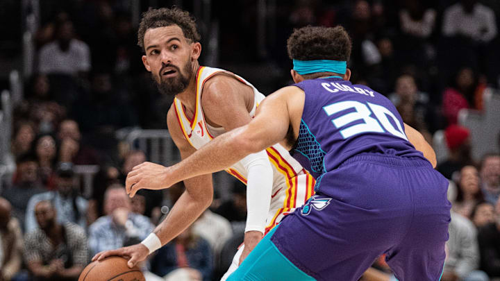Oct 25, 2024; Atlanta, Georgia, USA; Atlanta Hawks guard Trae Young (11) protects the ball against Charlotte Hornets guard Seth Curry (30) during the fourth quarter at State Farm Arena. Mandatory Credit: Jordan Godfree-Imagn Images Oct 25, 2024; Atlanta, Georgia, USA; Atlanta Hawks guard Trae Young (11) protects the ball against Charlotte Hornets guard Seth Curry (30) during the fourth quarter at State Farm Arena. Mandatory Credit: Jordan Godfree-Imagn Images