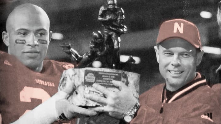 Frank Solich and Mike Brown with the Fiesta Bowl trophy after the win against Tennessee.. Frank Solich and Mike Brown with the Fiesta Bowl trophy after the win against Tennessee..
