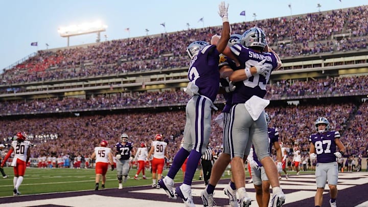 Kansas State Wildcats players celebrate a touchdown by Kansas State Wildcats tight end Will Swanson (83) during the first quarter of the game against Arizona at Bill Snyder Family Stadium Friday, September 13, 2024.