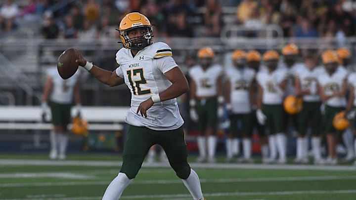 Bishop Manogue’s Brandon Mann looks to pass while taking on Damonte Ranch in Reno on Aug. 16, 2024.