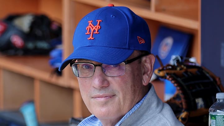 May 17, 2025; Bronx, New York, USA; New York Mets owner Steve Cohen sits in the dugout after batting practice before a game against the New York Yankees at Yankee Stadium. Mandatory Credit: Brad Penner-Imagn Images