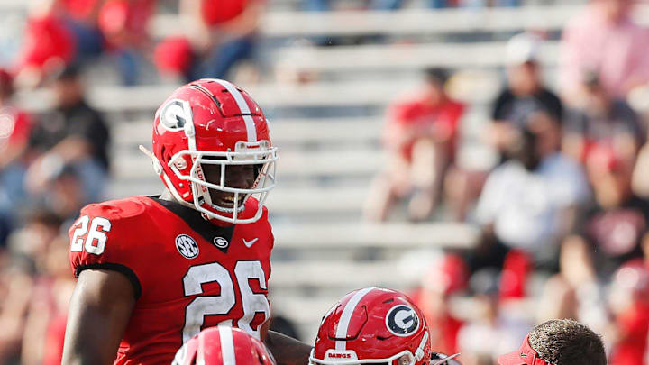 Georgia outside linebacker Damon Wilson Jr. (35) celebrates with Georgia outside linebacker Samuel M'Pemba (26) and Georgia inside linebacker Terrell Foster (30) aft getting a sack during the UGA G-Day spring football game at Sanford Stadium in Athens, Ga., on Saturday, April 15, 2023. Red won 31-26.

News Joshua L Jones