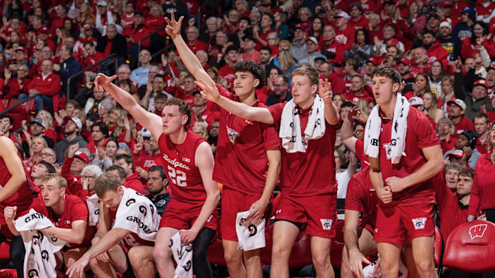 Wisconsin's bench celebrates during the Badgers' 96-76 victory over the Marquette Golden Eagles at the Kohl Center.