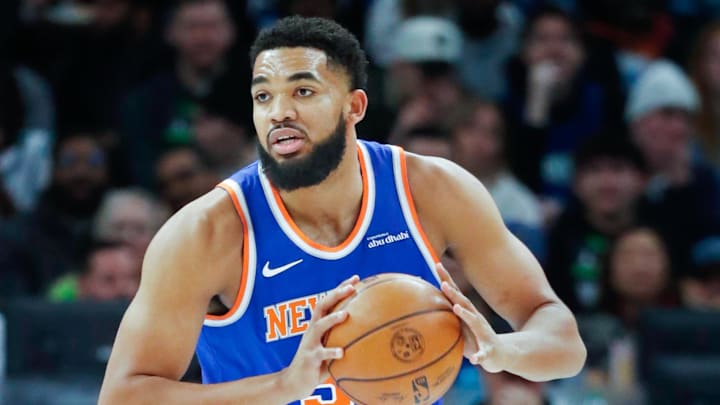 Dec 19, 2024; Minneapolis, Minnesota, USA; New York Knicks forward Karl-Anthony Towns (32) grabs a rebound from the Minnesota Timberwolves in the first quarter at Target Center. Mandatory Credit: Bruce Kluckhohn-Imagn Images