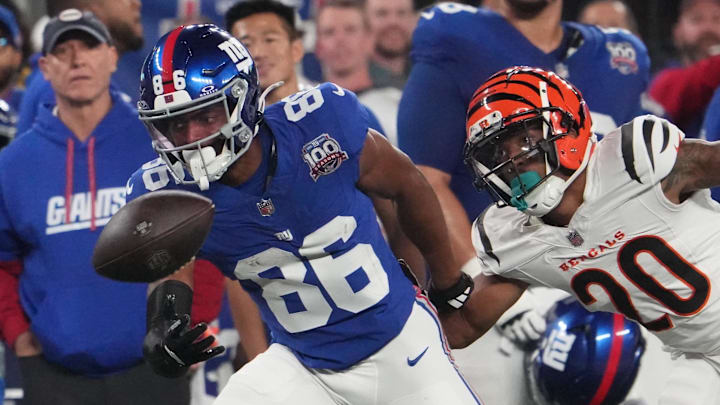 Oct 13, 2024; East Rutherford, New Jersey, USA;  New York Giants wide receiver Darius Slayton (86) can't get to a pass defended by Cincinnati Bengals cornerback DJ Turner II (20) during the first half at MetLife Stadium.  