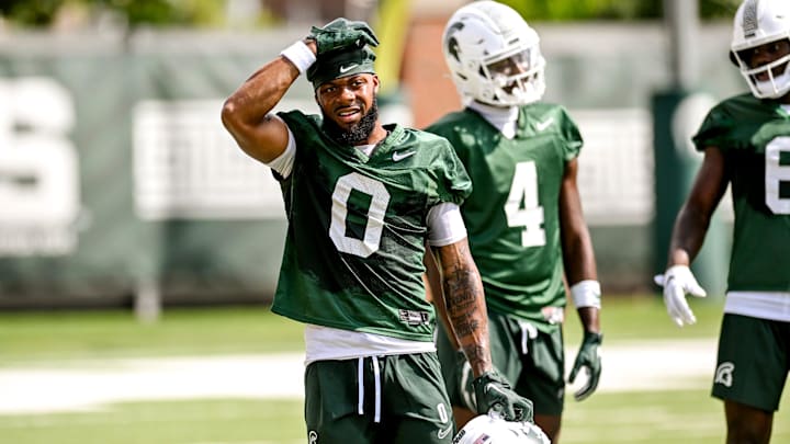Michigan State's Alante Brown takes a break during the first day of football camp on Tuesday, July 30, 2024, in East Lansing.
