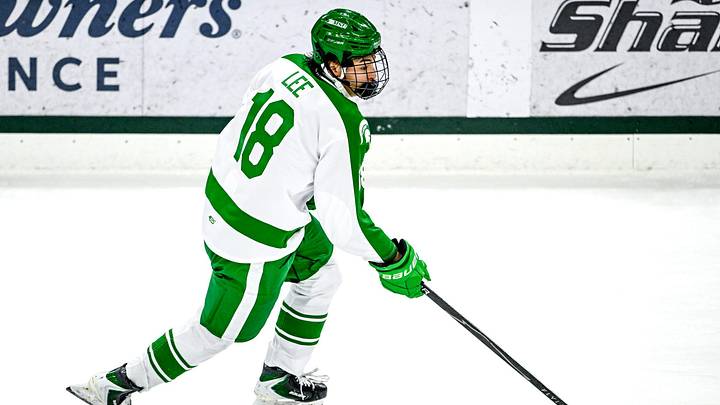 Michigan State's Ryker Lee moves the puck against Notre Dame during the first period on Thursday, Feb. 19, 2026, at the Munn Ice Arena in East Lansing.