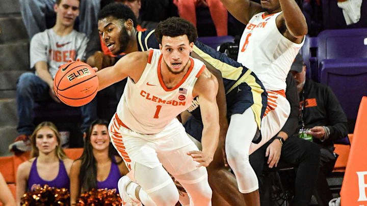 Nov 4, 2024; Clemson, SC, USA; Clemson guard Chase Hunter (1) brings the ball up court near Charleston Southern University guard Lamar Oden Jr (1) during the first half at Littlejohn Coliseum in Clemson, S.C Monday, November 4, 2024. Nov 4, 2024; Clemson, SC, USA; Clemson guard Chase Hunter (1) brings the ball up court near Charleston Southern University guard Lamar Oden Jr (1) during the first half at Littlejohn Coliseum in Clemson, S.C Monday, November 4, 2024.