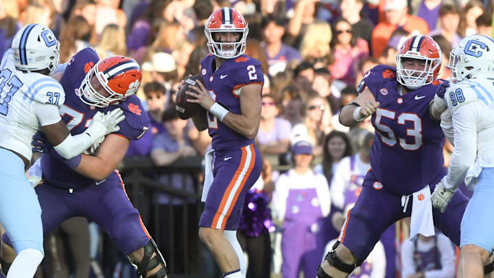 Nov 23, 2024; Clemson, South Carolina, USA; Clemson Tigers quarterback Cade Klubnik (2) looks for a receiver before running for a first down against The Citadel Bulldogs during the second quarter at Memorial Stadium. 