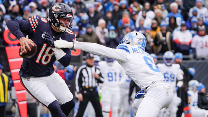 Caleb Williams eludes Lions safety Ifeatu Melifonwu in the open field while looking to pass in Sunday's Bears loss. Caleb Williams eludes Lions safety Ifeatu Melifonwu in the open field while looking to pass in Sunday's Bears loss.