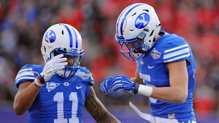 Dec 19, 2015; Las Vegas, NV, USA; BYU Cougars wide receiver Nick Kurtz (5) celebrates with wide receiver Terenn Houk (11) after scoring a touchdown against Utah in the Las Vegas Bowl at Sam Boyd Stadium. Utah won the game 35-28. Mandatory Credit: Stephen R. Sylvanie-USA TODAY Sports