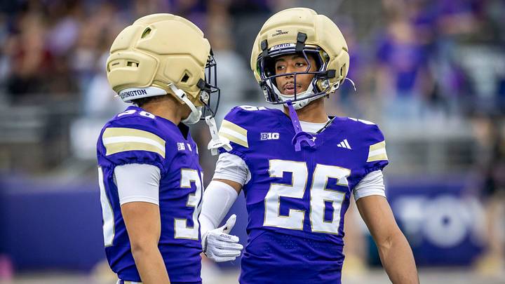 Elias Johnson (26) confers with fellow cornerback Kayden Greene. Elias Johnson (26) confers with fellow cornerback Kayden Greene.