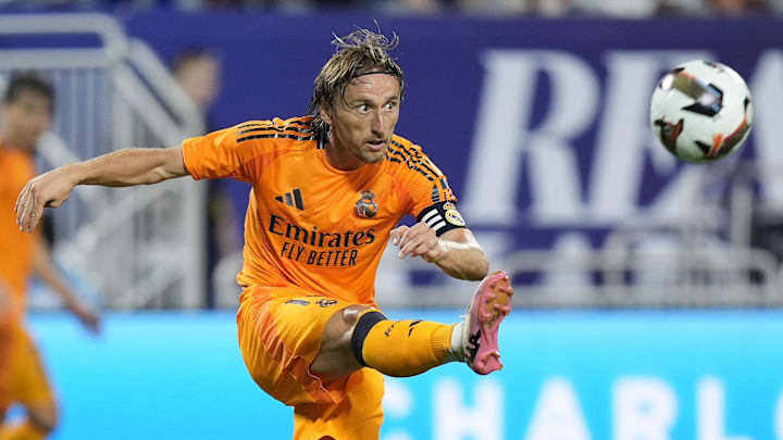 Aug 6, 2024; Charlotte, NC, USA; Real Madrid midfielder Luka Modric (10) kicks the ball up field against Chelsea during the second half at Bank of America Stadium. Mandatory Credit: Jim Dedmon-Imagn Images