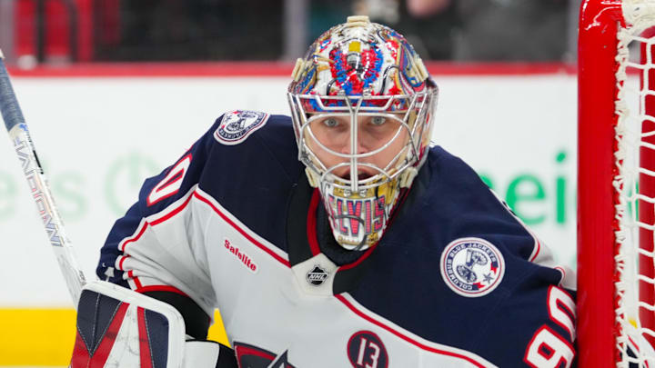 Dec 15, 2024; Raleigh, North Carolina, USA; Columbus Blue Jackets goaltender Elvis Merzlikins (90) looks on against the Carolina Hurricanes during the third period at Lenovo Center. Mandatory Credit: James Guillory-Imagn Images Dec 15, 2024; Raleigh, North Carolina, USA; Columbus Blue Jackets goaltender Elvis Merzlikins (90) looks on against the Carolina Hurricanes during the third period at Lenovo Center. Mandatory Credit: James Guillory-Imagn Images