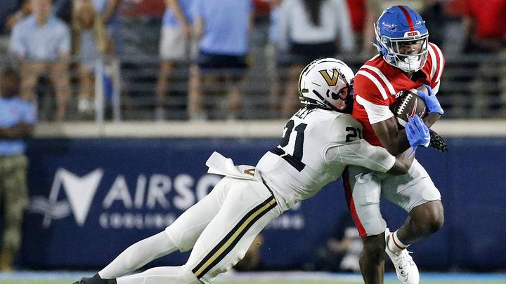 Mississippi Rebels wide receiver Ayden Williams runs after a catch as Vanderbilt Commodores defensive back Savion Riley makes the tackle during the second half at Vaught-Hemingway Stadium. Mississippi Rebels wide receiver Ayden Williams runs after a catch as Vanderbilt Commodores defensive back Savion Riley makes the tackle during the second half at Vaught-Hemingway Stadium.