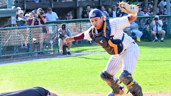 COTUIT 07/05/23 Cotuit catcher Caleb Lomavita reacts after tagging Nate Humphreys of Falmouth as he dives into home. COTUIT 07/05/23 Cotuit catcher Caleb Lomavita reacts after tagging Nate Humphreys of Falmouth as he dives into home.