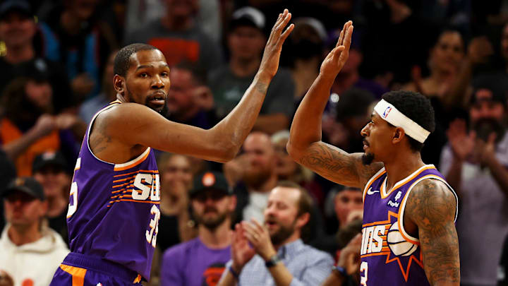 Mar 3, 2024; Phoenix, Arizona, USA; Phoenix Suns forward Kevin Durant (35) celebrates with guard Bradley Beal (3) during the first quarter of the game against the Oklahoma City Thunder at Footprint Center. Mandatory Credit: Mark J. Rebilas-Imagn Images