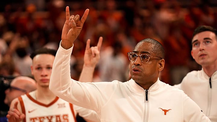 Texas Longhorns head coach Rodney Terry holds up the sign of the horns during \"The Eyes of Texas,\" after the 76-72 loss to Houston at the Moody Center on Monday, Jan. 29, 2024, in Austin.