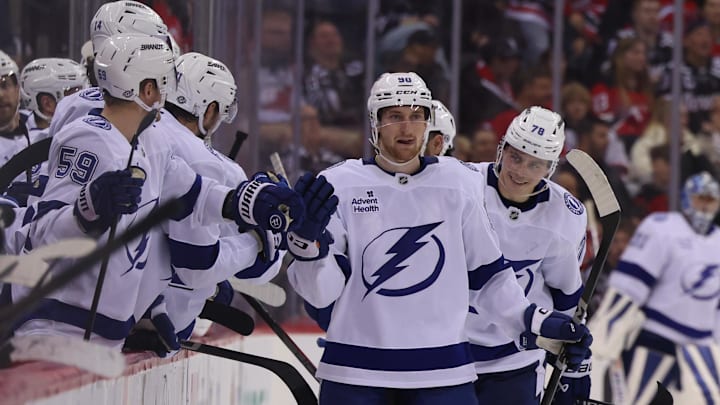 Oct 22, 2024; Newark, New Jersey, USA; Tampa Bay Lightning defenseman Janis Moser (90) celebrates his goal against the New Jersey Devils during the third period at Prudential Center. Mandatory Credit: Ed Mulholland-Imagn Images