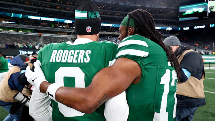 Jan 5, 2025; East Rutherford, New Jersey, USA; New York Jets quarterback Aaron Rodgers (8) and wide receiver Davante Adams (17) walk on the field after the Jets win over the Miami Dolphins at MetLife Stadium. Mandatory Credit: Ed Mulholland-Imagn Images Jan 5, 2025; East Rutherford, New Jersey, USA; New York Jets quarterback Aaron Rodgers (8) and wide receiver Davante Adams (17) walk on the field after the Jets win over the Miami Dolphins at MetLife Stadium. Mandatory Credit: Ed Mulholland-Imagn Images