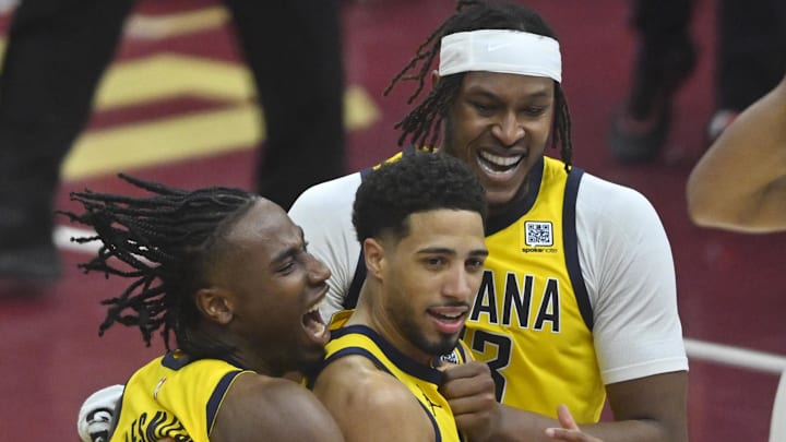 May 6, 2025; Cleveland, Ohio, USA; Indiana Pacers guard Tyrese Haliburton (center) celebrates the game-winning three-point basket with forward Aaron Nesmith (23) and center Myles Turner (33) after game two of the second round of the 2025 NBA Playoffs against the Cleveland Cavaliers at Rocket Arena. Mandatory Credit: David Richard-Imagn Images