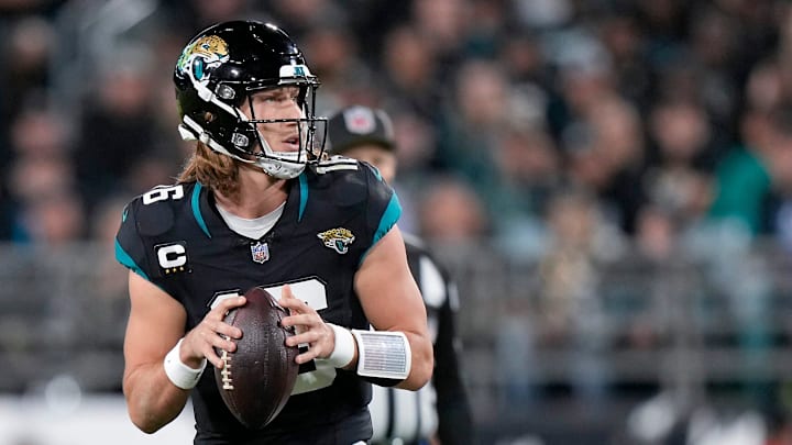 Jacksonville Jaguars quarterback Trevor Lawrence (16) drops back to throw in the first half of a
