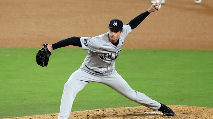 Oct 26, 2024; Los Angeles, California, USA; New York Yankees pitcher Tim Hill (54) throws a pitch against the Los Angeles Dodgers in the sixth inning for game two of the 2024 MLB World Series at Dodger Stadium. Oct 26, 2024; Los Angeles, California, USA; New York Yankees pitcher Tim Hill (54) throws a pitch against the Los Angeles Dodgers in the sixth inning for game two of the 2024 MLB World Series at Dodger Stadium.