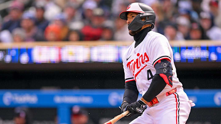 Apr 3, 2025; Minneapolis, Minnesota, USA;  Minnesota Twins infielder Carlos Correa (4) drives in a run on a broken-bat fielder’s choice against the Houston Astros during there first inning at Target Field.