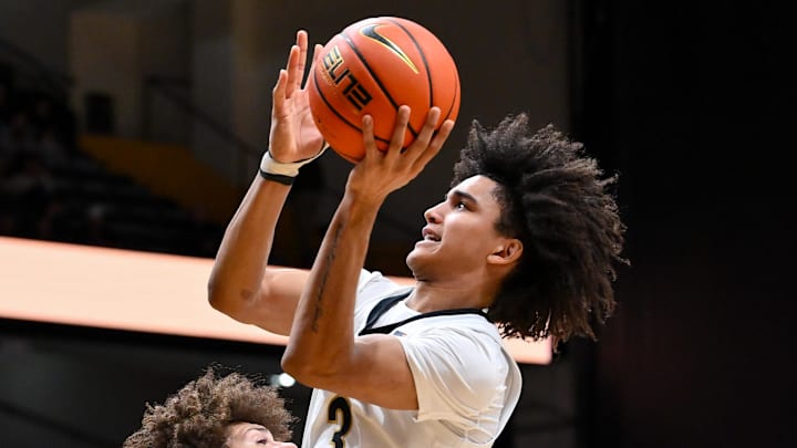 Dec 29, 2025; Nashville, Tennessee, USA;  Vanderbilt Commodores guard Tyler Tanner (3) shoots over  New Haven Chargers guard Jabri Fitzpatrick (1) during the second half at Memorial Gymnasium. Mandatory Credit: Steve Roberts-Imagn Images