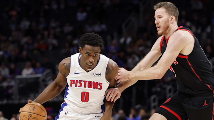 Dec 30, 2023; Detroit, Michigan, USA; Detroit Pistons center Jalen Duren (0) dribbles defended by Toronto Raptors center Jakob Poeltl (19): Rick Osentoski-Imagn Images