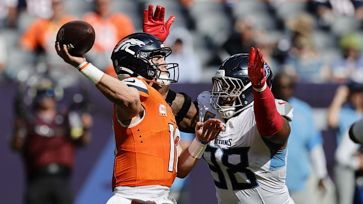 Sep 7, 2025; Denver, Colorado, USA; Tennessee Titans defensive tackle Jeffery Simmons (98) pressures Denver Broncos quarterback Bo Nix (10) in the second half at Empower Field at Mile High. 