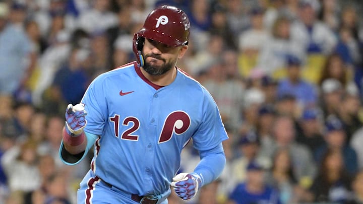 Oct 8, 2025; Los Angeles, California, USA; Philadelphia Phillies designated hitter Kyle Schwarber (12) looks into the dugout after hitting a solo home run during the fourth inning against the Los Angeles Dodgers in game three of the NLDS during the 2025 MLB playoffs at Dodger Stadium. Mandatory Credit: Jayne Kamin-Oncea-Imagn Images