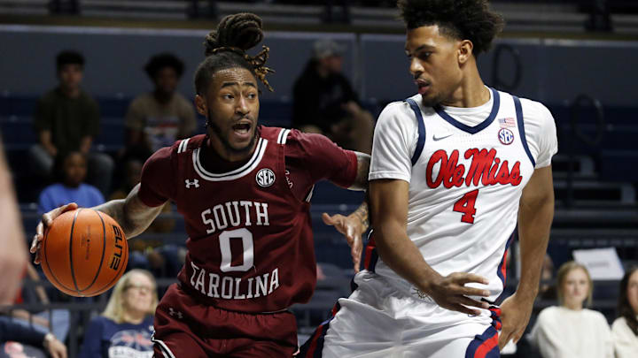 Feb 15, 2022; Oxford, Mississippi, USA; South Carolina Gamecocks guard James Reese V (0) drives to the basket as Mississippi Rebels forward Jaemyn Brakefield (4) defends during the first half at The Sandy and John Black Pavilion at Ole Miss. Mandatory Credit: Petre Thomas-Imagn Images