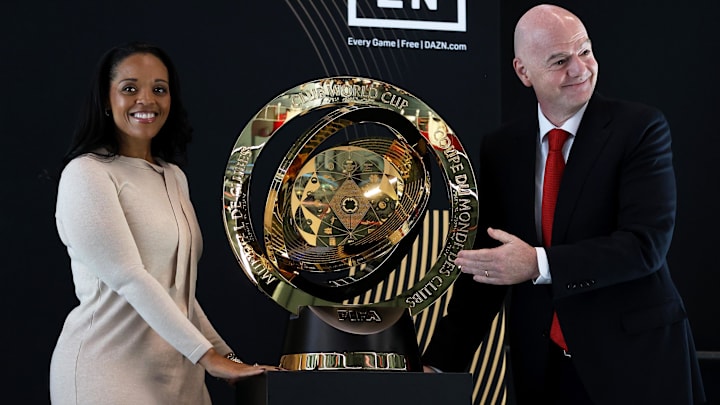 Apr 16, 2025; Washington, DC, USA; D.C. United President of Business Operations Danita Johnson (left) and FIFA president Gianni Infantino unveil the Club World Cup trophy during a FIFA Club World Cup press conference at Audi Field. Mandatory Credit: Daniel Kucin Jr.-Imagn Images