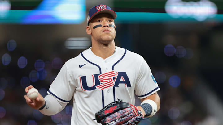 Mar 17, 2026; Miami, FL, United States; United States right fielder Aaron Judge (99) throws the ball before the first inning to a fan during the 2026 World Baseball Classic Championship game at loanDepot Park. Mandatory Credit: Sam Navarro-Imagn Images