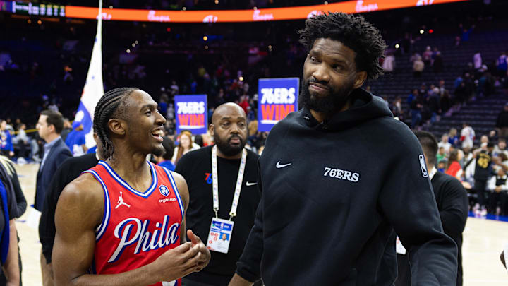 Jan 24, 2025; Philadelphia, Pennsylvania, USA; Philadelphia 76ers guard Tyrese Maxey (L) reacts with injured Joel Embiid (R) after a victory against the Cleveland Cavaliers at Wells Fargo Center. Mandatory Credit: Bill Streicher-Imagn Images Jan 24, 2025; Philadelphia, Pennsylvania, USA; Philadelphia 76ers guard Tyrese Maxey (L) reacts with injured Joel Embiid (R) after a victory against the Cleveland Cavaliers at Wells Fargo Center. Mandatory Credit: Bill Streicher-Imagn Images