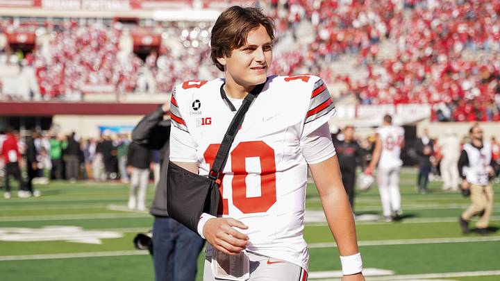 Oct 17, 2026; Bloomington, Indiana, USA; Ohio State Buckeyes quarterback Julian Sayin (10) walks off the field with his arm in a sling after the game against the Indiana Hoosiers Merchants Bank Field at Memorial Stadium. Mandatory Credit: Robert Goddin-Imagn Images Oct 17, 2026; Bloomington, Indiana, USA; Ohio State Buckeyes quarterback Julian Sayin (10) walks off the field with his arm in a sling after the game against the Indiana Hoosiers Merchants Bank Field at Memorial Stadium. Mandatory Credit: Robert Goddin-Imagn Images