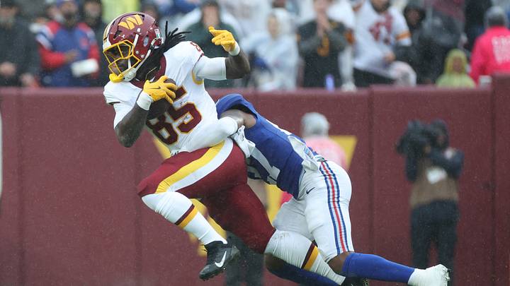 Oct 11, 2026; Landover, Maryland, USA; New York Giants safety Tyler Nubin (27) tackles Washington Commanders tight end Chig Okonkwo (85) during the first quarter at Northwest Stadium. Mandatory Credit: Amber Searls-Imagn Images Oct 11, 2026; Landover, Maryland, USA; New York Giants safety Tyler Nubin (27) tackles Washington Commanders tight end Chig Okonkwo (85) during the first quarter at Northwest Stadium. Mandatory Credit: Amber Searls-Imagn Images