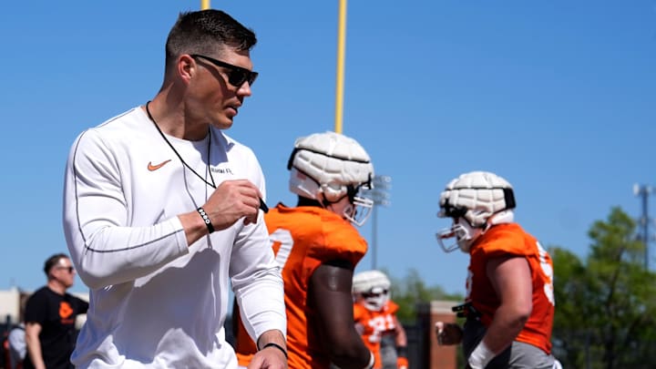 Oklahoma State offensive lineman coach Cooper Bassett runs drills during a Spring football practice at Oklahoma State University in Stillwater, Okla., Tuesday, April, 8, 2025.