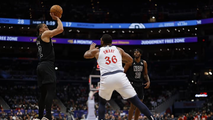 Smart defends Nets forward Jalen Wilson.