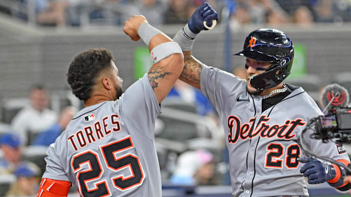 Detroit Tigers center fielder Javier Baez (28) celebrates with second baseman Gleyber Torres (25) after hitting a solo home run against the Toronto Blue Jays at the Rogers Centre. 