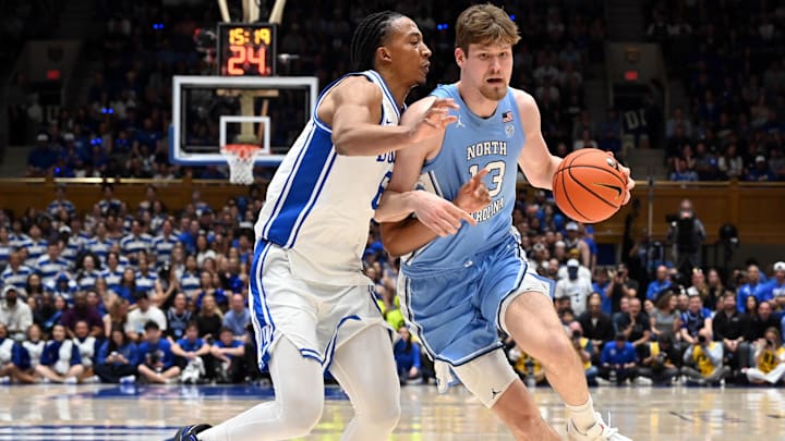 Mar 7, 2026; Durham, North Carolina, USA; North Carolina Tar Heels center Henri Veesaar (13) drives to the basket as Duke Blue Devils forward Maliq Brown (6) defends during the first half at Cameron Indoor Stadium. Mandatory Credit: Rob Kinnan-Imagn Images