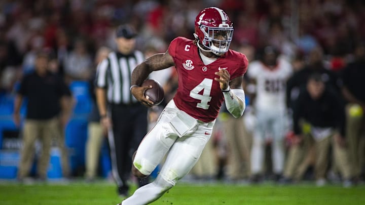 Sep 28, 2024; Tuscaloosa, Alabama, USA;  Alabama Crimson Tide quarterback Jalen Milroe (4) runs against the Georgia Bulldogs during the first quarter at Bryant-Denny Stadium. Mandatory Credit: Will McLelland-Imagn Images