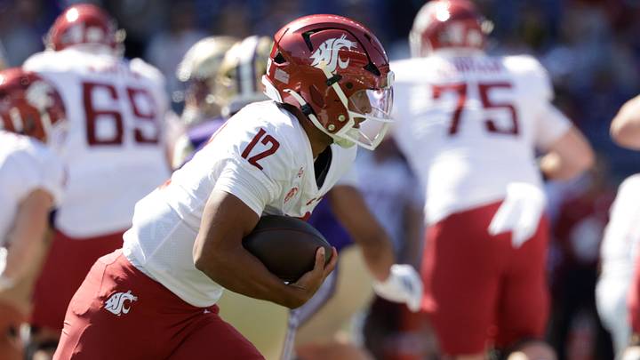 WSU quarterback Caden Pinnick (12) carries the ball against the Washington Huskies during the first quarter at Husky Stadium. WSU quarterback Caden Pinnick (12) carries the ball against the Washington Huskies during the first quarter at Husky Stadium.