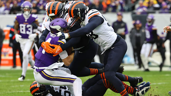 Bears defensive end Montez Sweat knocks down Vikings QB Sam Darnold during the second half in Monday's Minnesota win.